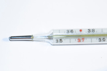  glass old retro thermometer on a white background in closeup