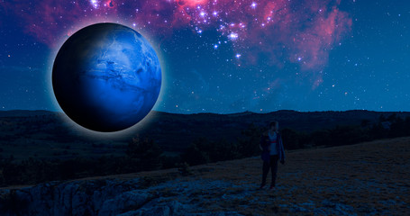 Fototapeta na wymiar fantasy sci-fi landscape on the earth with a huge planet in the sky during night elements of this image furnished by nasa