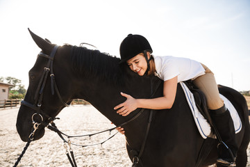 Beautiful woman wearing hat with horse