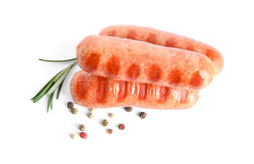 Grilled sausages and rosemary on white background, top view