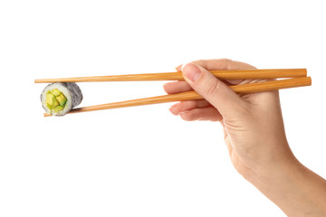 Woman holding sushi roll on white background, closeup © New Africa