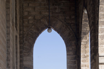 arch in a catholic temple against the sky