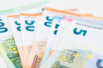 Euro bills of different values close up macro shot, image for business, banking background.