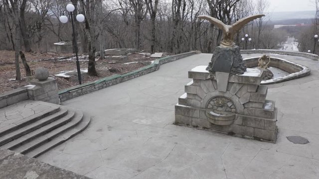 The resort town of Zheleznovodsk, a sculpture of an eagle spread its wings, as well as a drained fountain with a sculpture of Samson