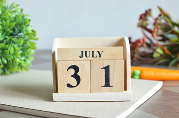 July 31, Appointment date with number cube design for background.	