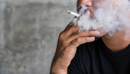 Close up asian man  smoking cigarette. Stop smoking concept