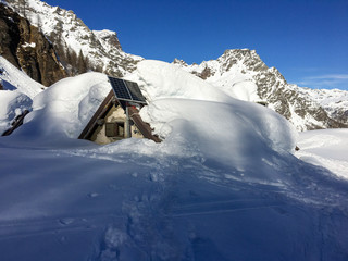 Fototapeta na wymiar Panoramic view of the snow covered Alpe Misanco in Piedmont Italy.