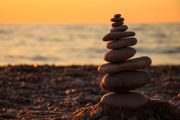 Zen concept. Sunset. The object of the stones on the beach at sunset.  Relax & Meditation. Zen stones.