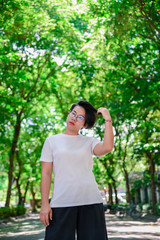 Beautiful girl on the street smiling in park.