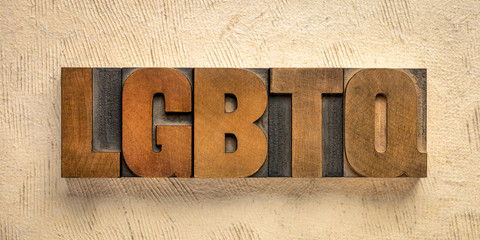 LGBTQ initialism in wood type blocks