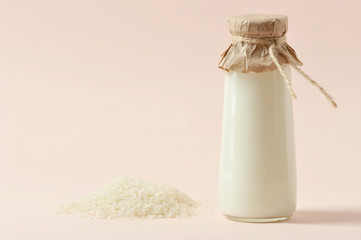 Rice milk and rice. The concept of products for a healthy diet. Light background. Close-up. Free space for text.