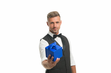 Gentleman delivering gift. Handsome man with wrapped gift box. Happy businessman hold present in hand. Birthday holiday. Shopping mall. Shop purchase. Gift package. Womens day. Valentines day