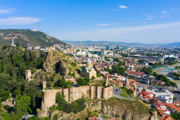 Panorama of the old town on Sololaki hill, crowned with Narikala fortress, the Kura river and cars...