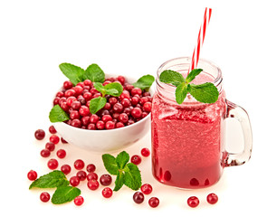 Cranberry smoothie in glass jar, healthy juicy pink vitamin drink, diet or vegan food concept. Freshly blended homemade fruit vitamins juicy cocktail. Tasty organic berries smoothie