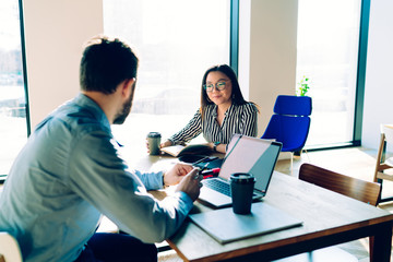 Colleagues having discussion in workspace