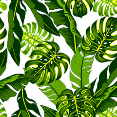 Summer seamless tropical pattern with bright green plants and leaves on a delicate background.  Printing and textiles.   Beautiful print with hand drawn exotic plants.