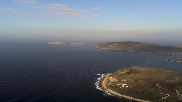 Flying above the ocean and playaBarizo, La Coruna, Galicia, Spain. View of sand beach and the cities nearby. Drone footage rotating from left to righ.