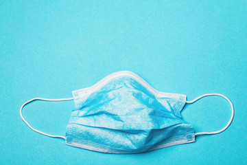 Blue disposable medical mask with copy space