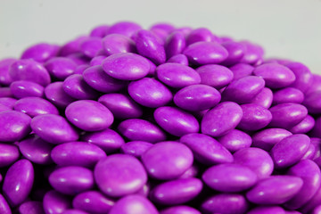 Obraz na płótnie Canvas purple colored chocolate confectionery