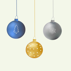 Three hanging Christmas balls of blue, silver and gold with a pattern of their circles, Christmas trees and snowflakes