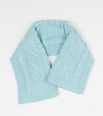 handmade wool scarf on vertical image, selective focus. mint trend color