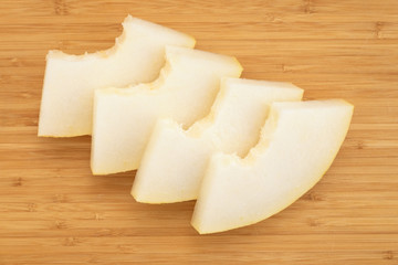 Fresh melon on a wooden board.