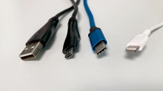 USB cable against white background USB-A USB-C Micro USB and Lightning Cable to connect