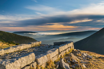 Karkonosze National Park, a beautiful view of the fog and clouds in the setting sun