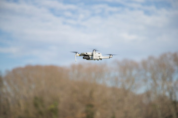 Fototapeta na wymiar Drone flying in the field.