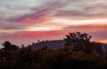 Colorful clouds at sunrise in California. A spectrum of saturated colors in the sky.