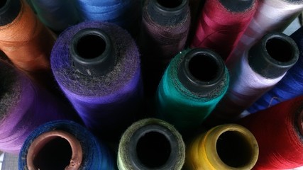 Colored thread coils close up, sewing thread, 