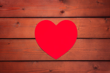 Valentines day background with Big red heart on a wooden background. Copyspace. Suitable for congratulations, greeting cards, decoration, declaration of love