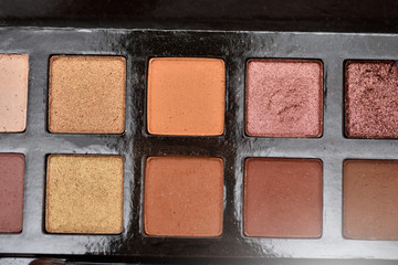 Palette of colors for makeup in a beauty studio by a makeup artist, the concept of beauty and health