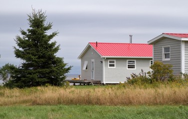 Obraz premium Cabins by the sea with metal roofs