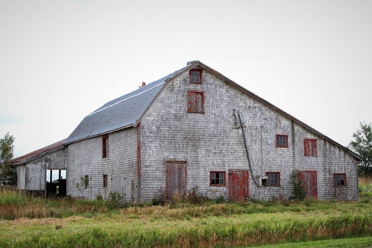 Old grey barn in rural countryside