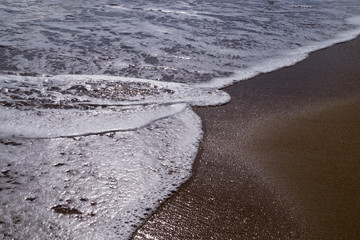 sea ​​wave on the beach at high tide