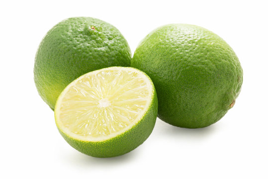 Limes - one sliced - isolated against white