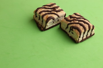 small chocolate cakes in color background