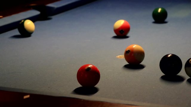 Close up of pool balls on a pool table.