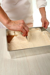 Spoon mixture into tin and smooth top. Making Chocolate Hazelnut Meringue Cake.