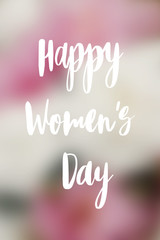 Happy women's day text on beautiful peonies blurred background. Stylish pink and white peony wallpaper, vertical image. Greeting card