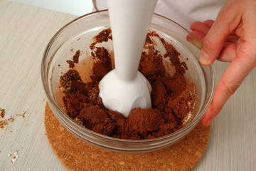 Making filling, process melted chocolate and nut mixture until combined and smooth. Making Chocolate Hazelnut Meringue Cake.