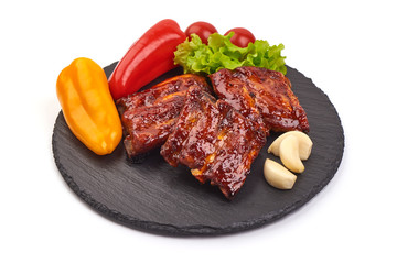 Delicious grilled pork ribs in BBQ, isolated on white background