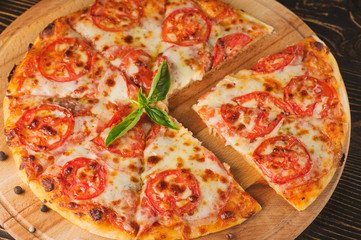 pizza with cherry tomatoes and black olives