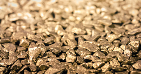 Pile of Gold Nuggets shining. Texture and Pattern