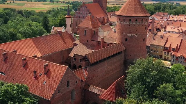 Drone view on a touristic city with medieval castle and church.