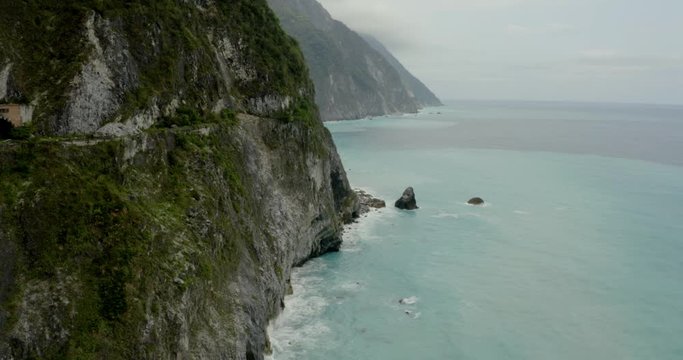 Qingshui cliff scenic seascape aerial view, Hualien. Following coastal ocean shoreline. Taiwan