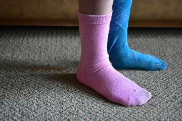 original and nonconformist child with mismatched socks