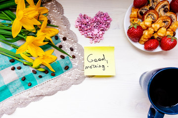 strawberry, cookie hearts with a Cup of grain black coffee, with yellow flowers and a leaf for a note with a Valentine's day mother woman Easter day