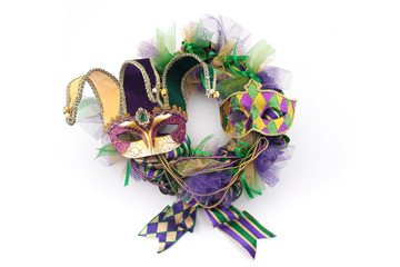 Mardi gras wreath isolated on white background with mardi gras mask. Top view © vetre